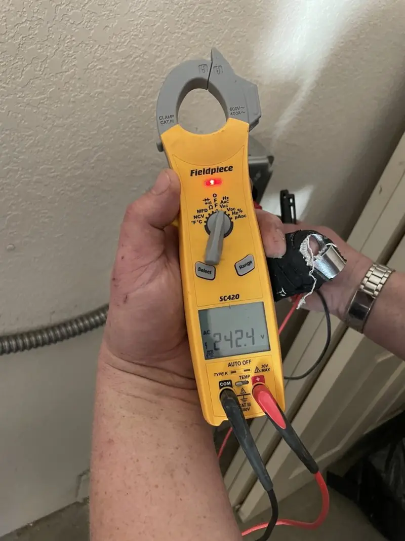 Voltage testing with clamp meter during Recessed Lighting Installation in Yazoo City